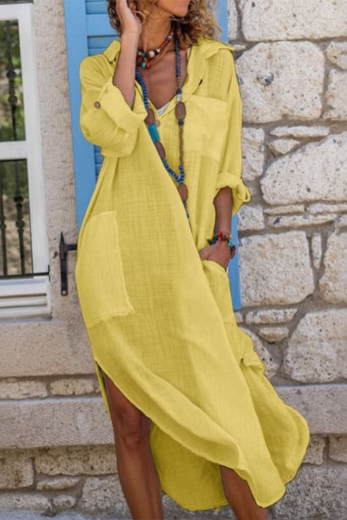 Stylish oversized women's midi shirt dress with pockets, perfect for a relaxed summer or evening look.