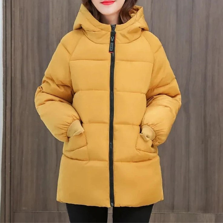 Women's oversized padded winter parka with hood, essential for ultimate warmth & style.