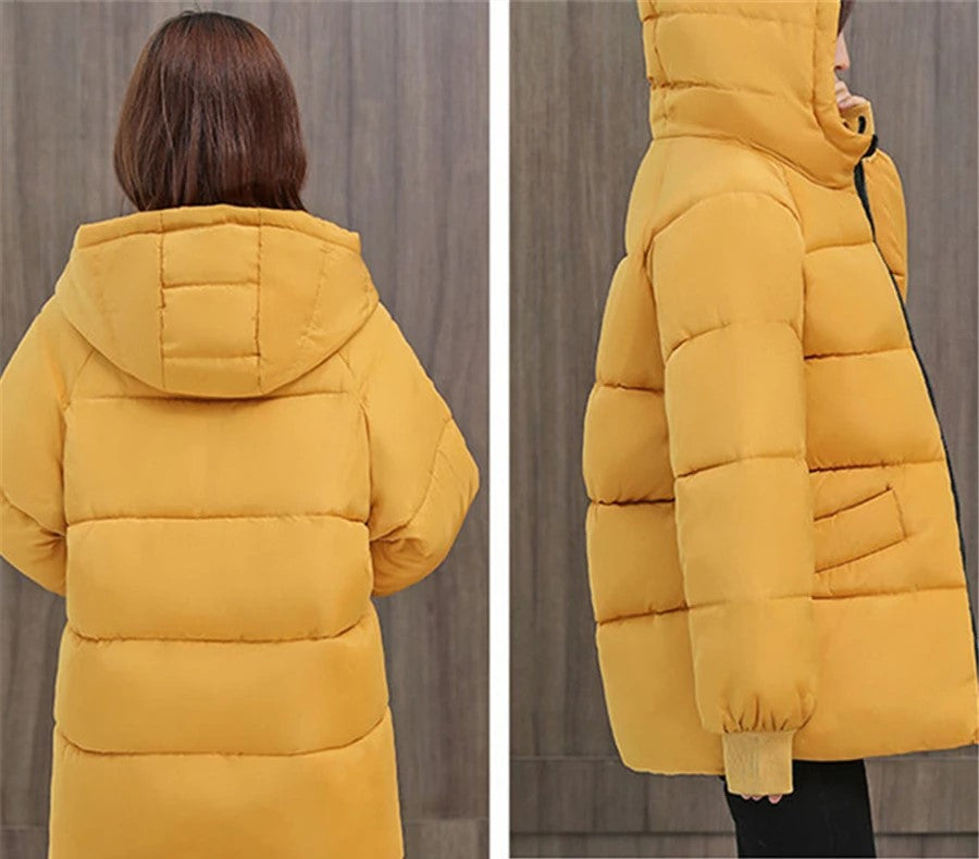 Women's oversized hooded puffer coat, providing exceptional warmth & a fashionable winter silhouette.