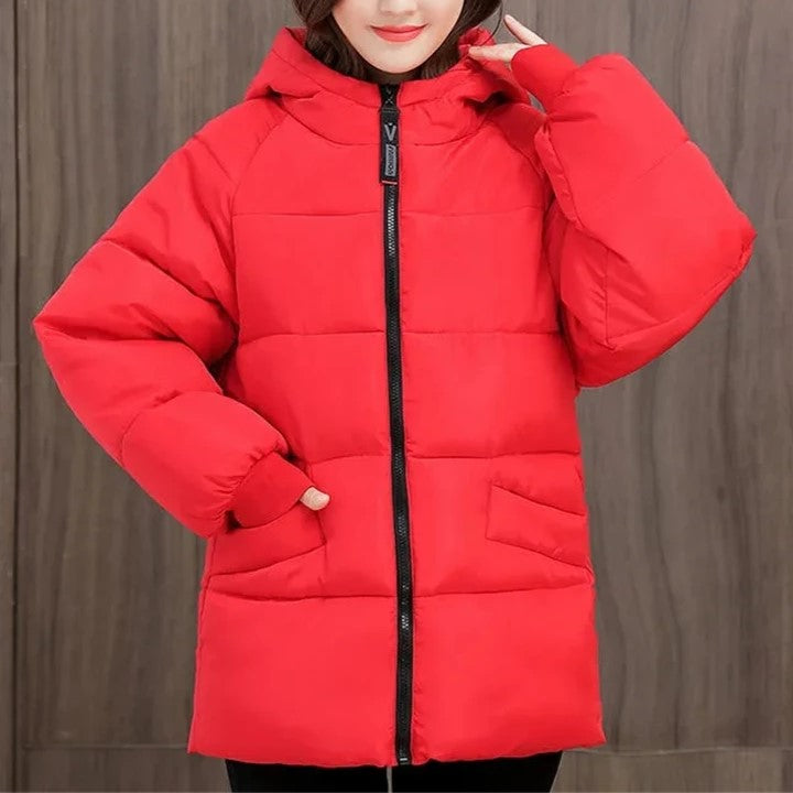 Fashionable women's cold weather parka, oversized & padded, a chic choice for winter.