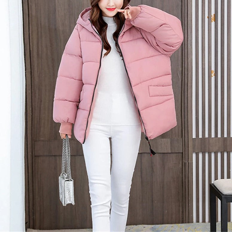 Elegant women's oversized hooded coat, puffer style, perfect for staying warm in winter fashion.