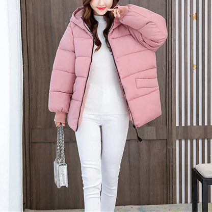 Elegant women's oversized hooded coat, puffer style, perfect for staying warm in winter fashion.