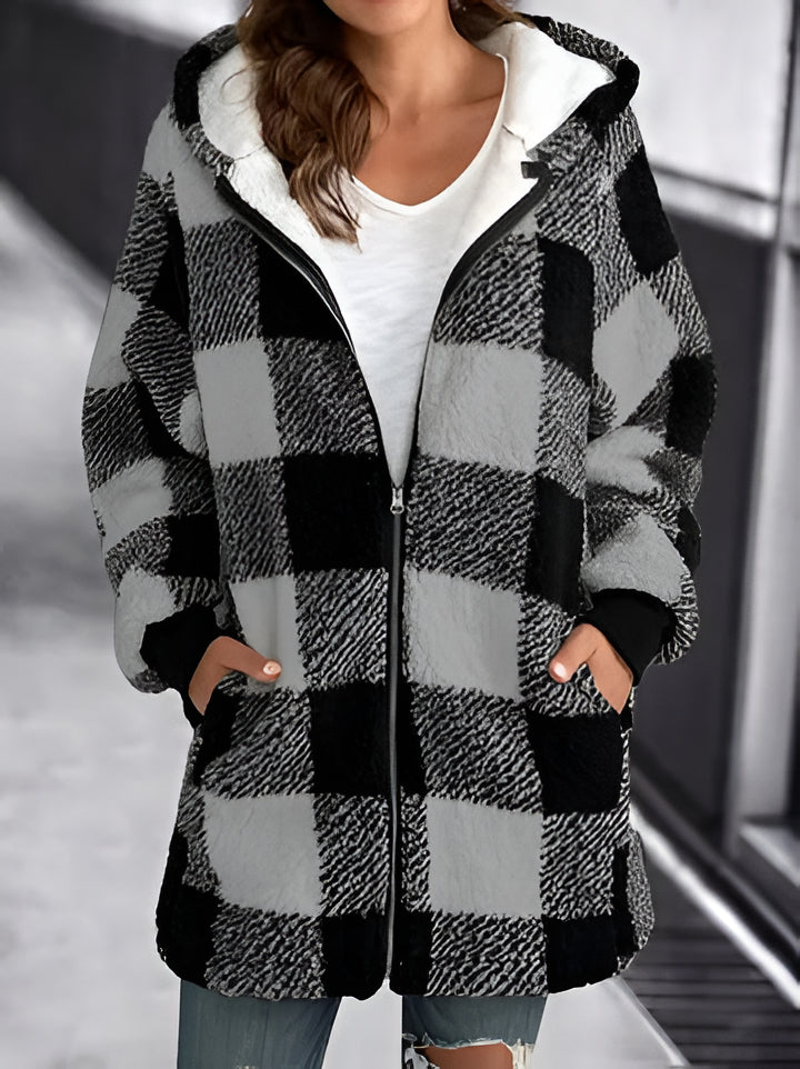 Cozy women's loose plaid overcoat. Comfortable layering piece for fall and winter casual wear.