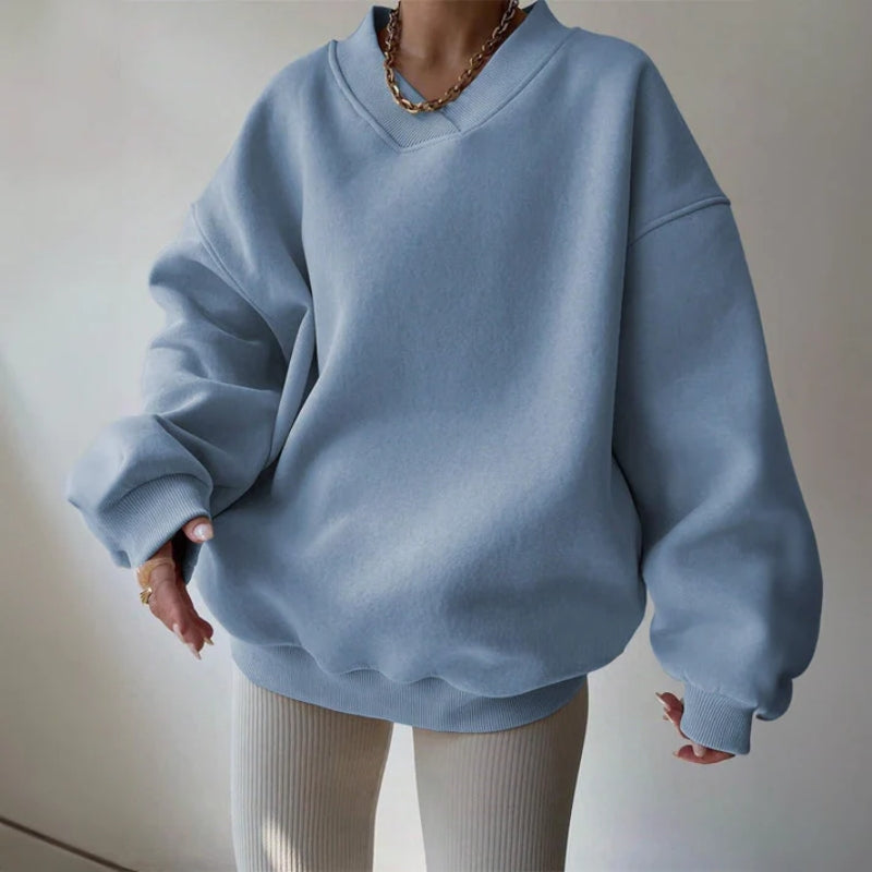 Blue women's relaxed fit pullover, featuring a soft knit and oversized design for ultimate comfort and style.