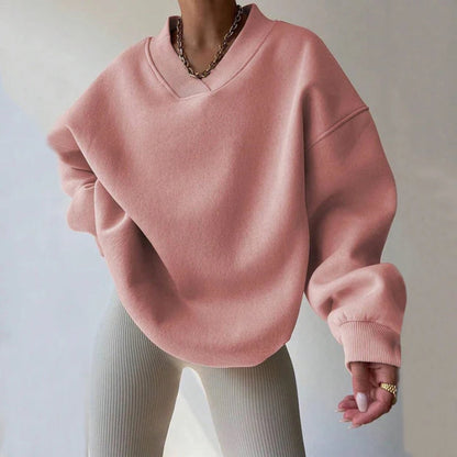 Pink women's oversized knit pullover, ideal for everyday wear, offering a blend of comfort and casual elegance.