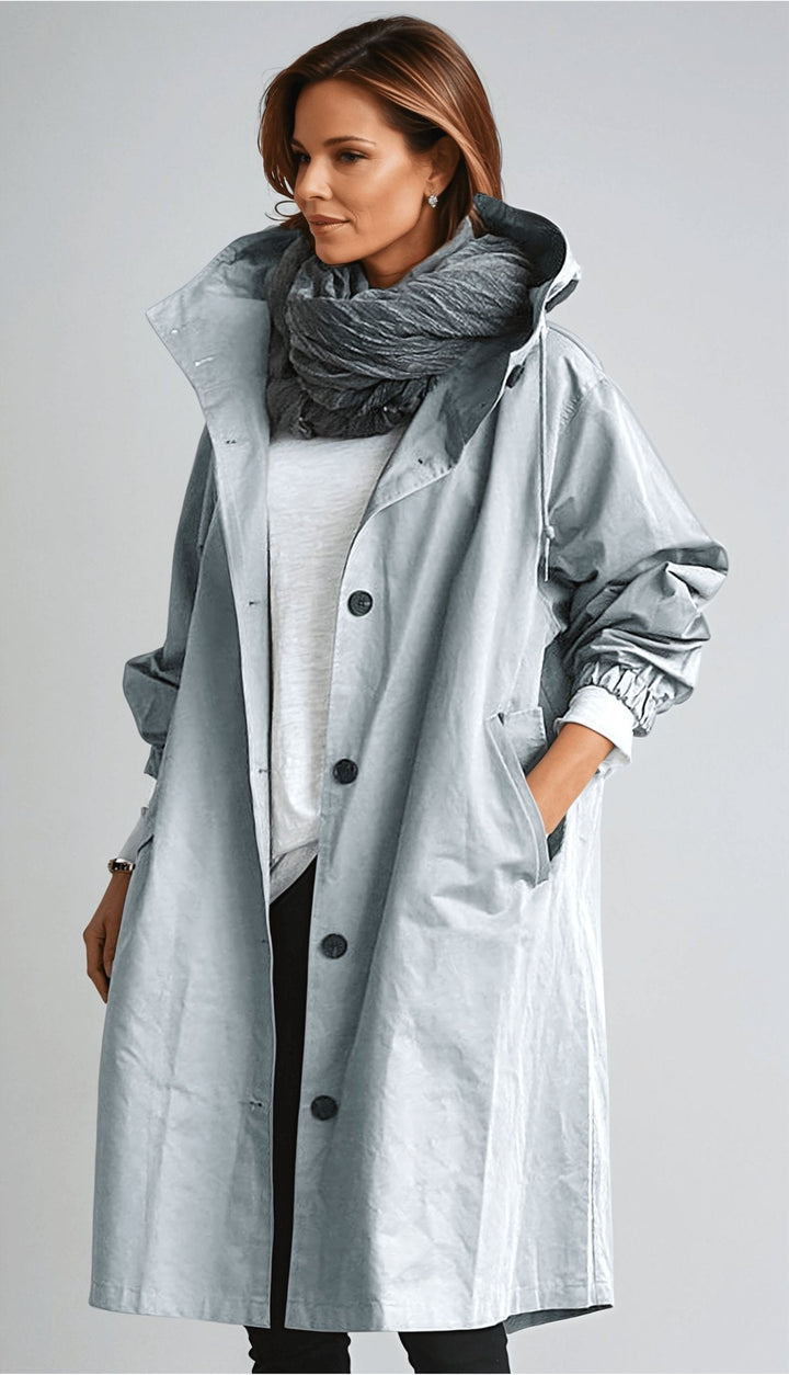 Women's oversized rain parka trench coat. Water resistant fall outerwear for elegant weather protection.