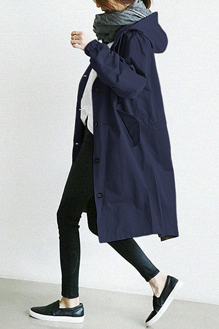 Elegant women's oversized rain trench coat. Classic design provides weather protection for spring & fall.
