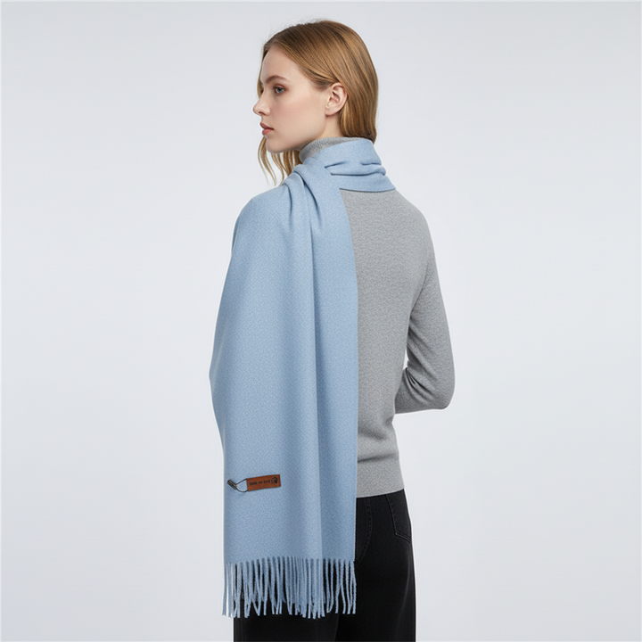 Fashionable women's oversized winter scarf, a soft feel accessory providing cozy warmth for cold weather.