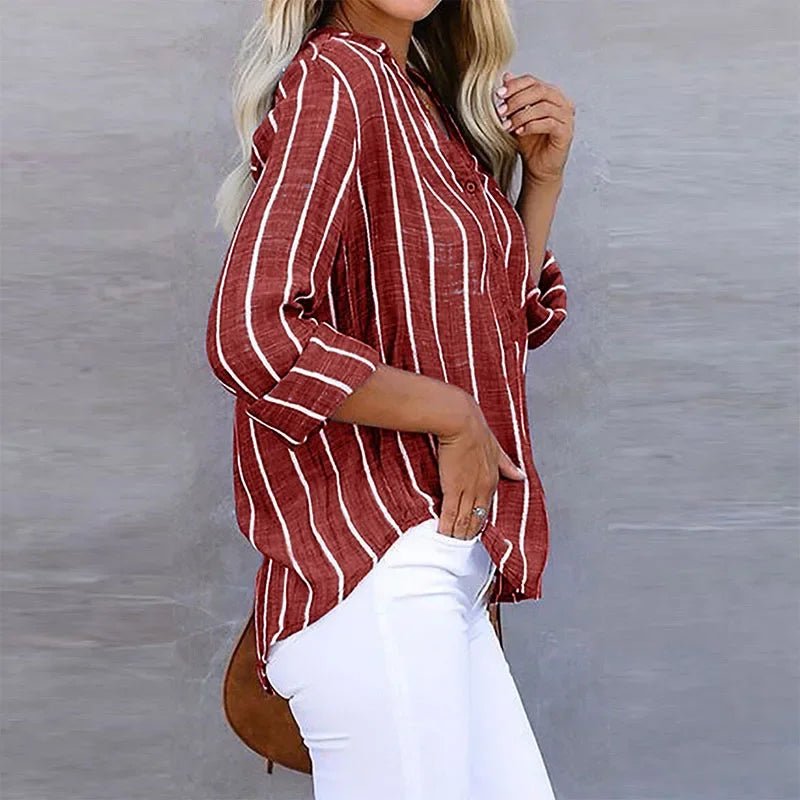 Model wearing a comfy women's oversized striped long-sleeve shirt. Everyday style, relaxed fit, versatile button-down.