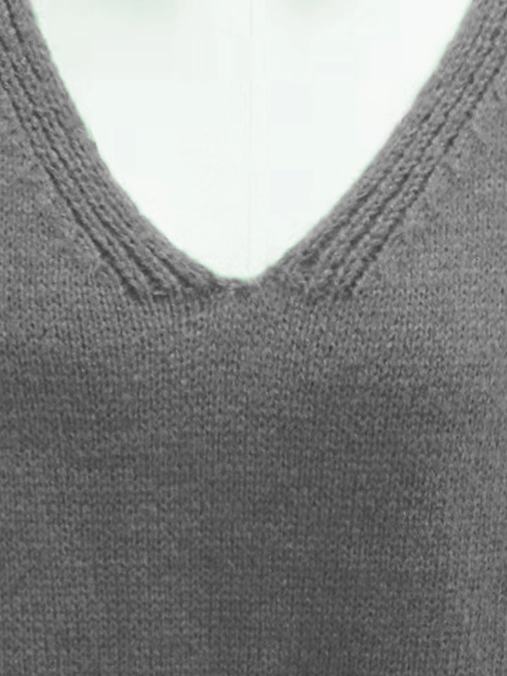 Fashionable women's oversized V-neck sweater, plus size. Perfect for fall & winter casual chic.