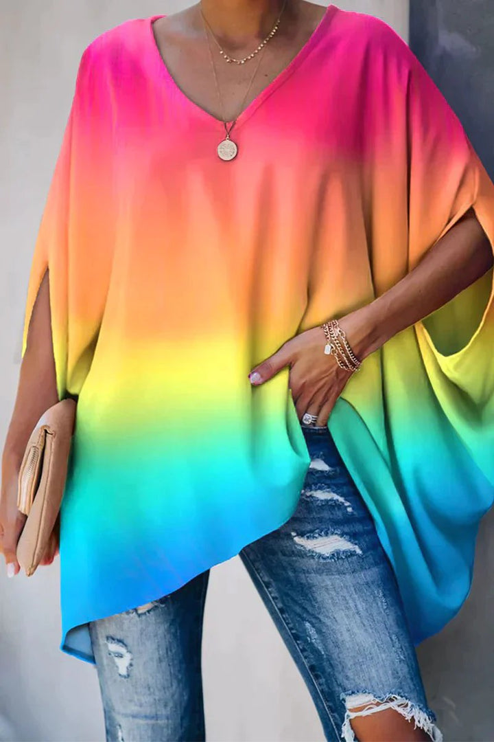 Flowy women's batwing sleeve tunic. Comfortable, oversized V-neck top for everyday style.