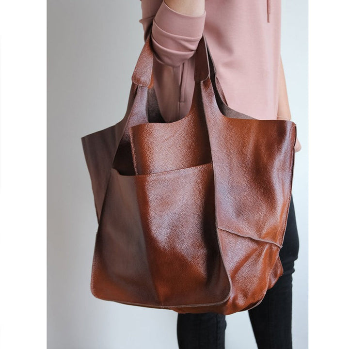 Authentic vintage oversized leather shoulder bag for women, durable daily companion.