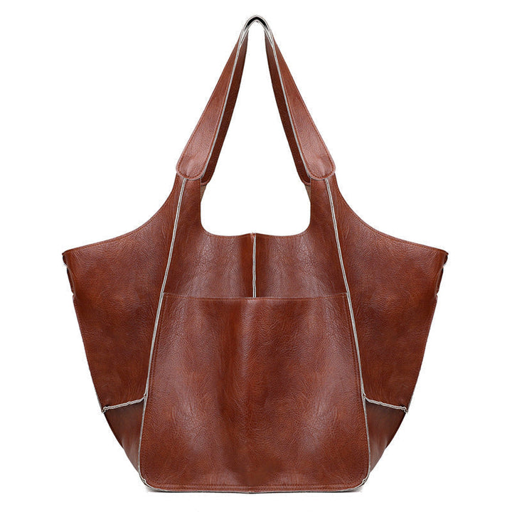 Versatile black oversized vintage leather shoulder bag for women, adaptable to any look.