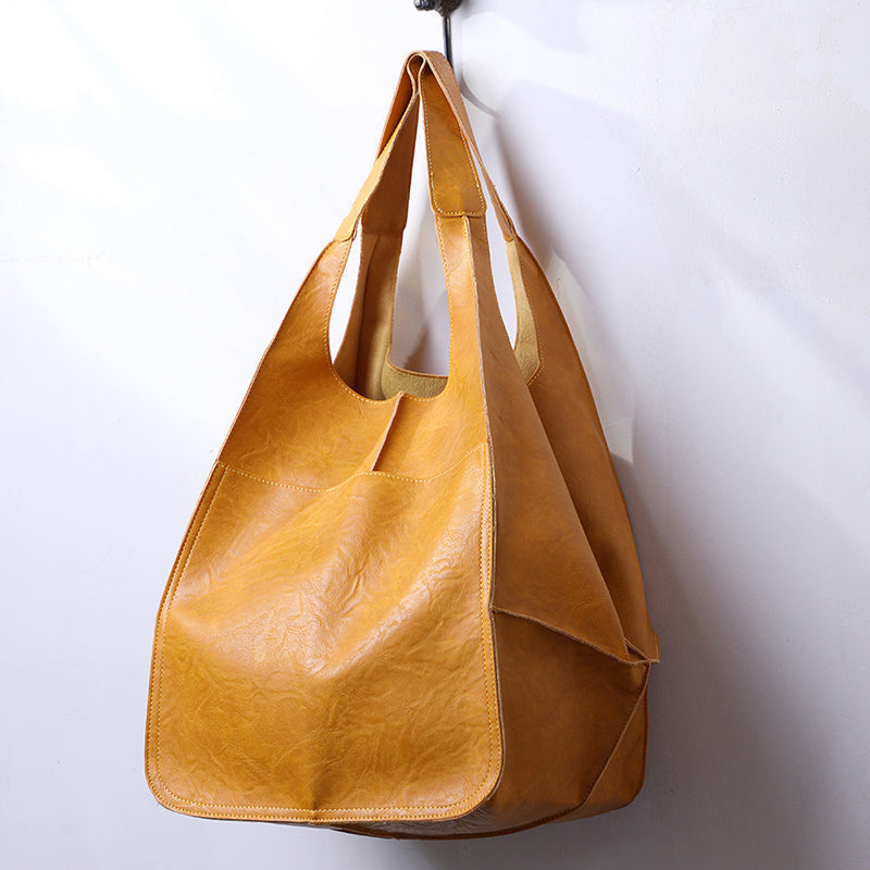 Stylish black oversized vintage leather shoulder bag for women, a timeless fashion accessory.