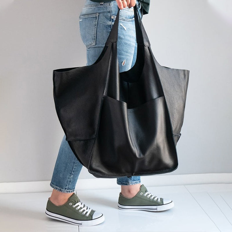 Tan oversized vintage leather shoulder bag, women's spacious everyday carryall with charm.