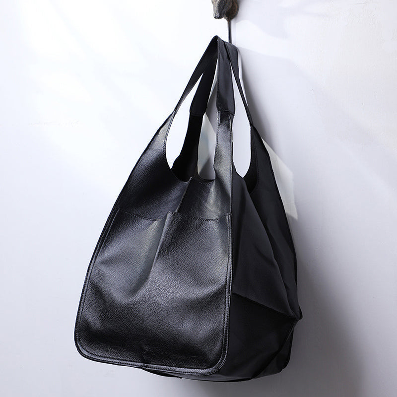 Spacious women's oversized vintage leather shoulder bag, organized storage for essentials.