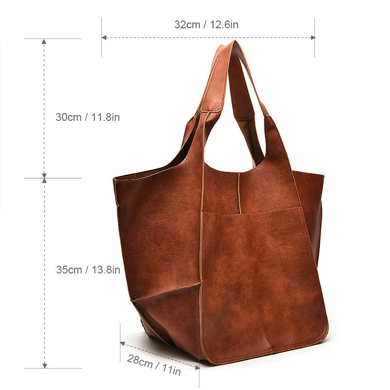 Close-up of comfortable handles on a women's oversized weekend travel bag.