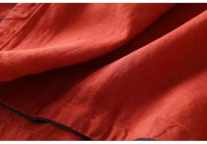 Women's patterned blouse with delicate embroidery, relaxed fit, elegant V-neck.