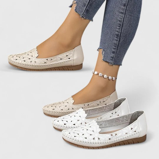 Women's Perforated Floral Slip-On Ballet Flats with comfortable round toe & scalloped edge for spring/summer style.