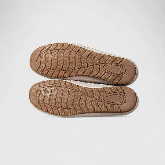 Versatile women's slip-on flats, featuring a floral cutout design, offering everyday elegance & comfortable spring style.