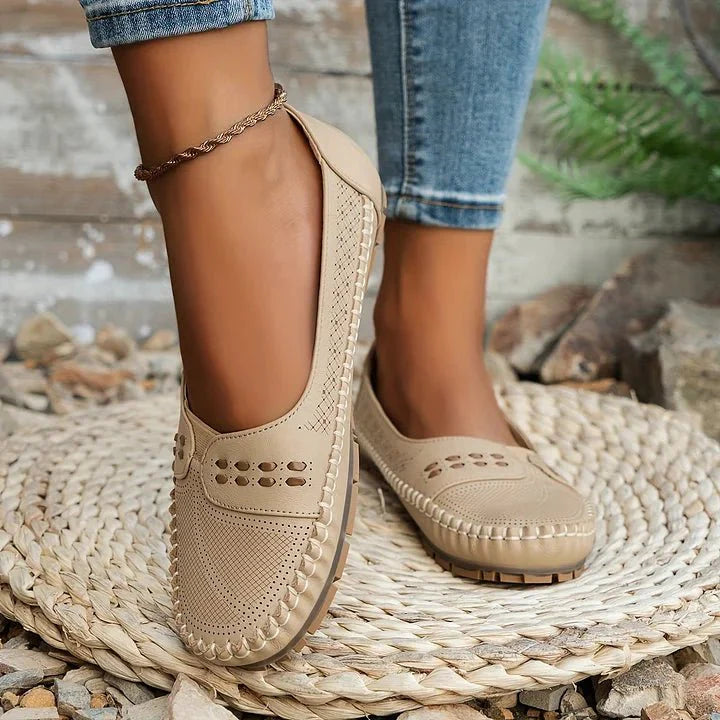 Comfortable women's orthopedic slip-on loafers with perforated design for breathability.