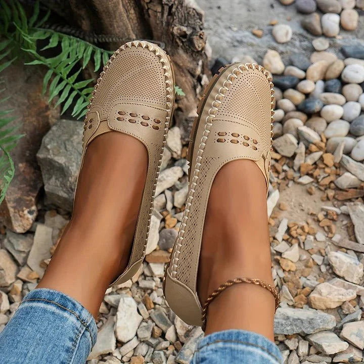 Stylish perforated slip-on flats for women, ideal for spring and summer casual outfits.