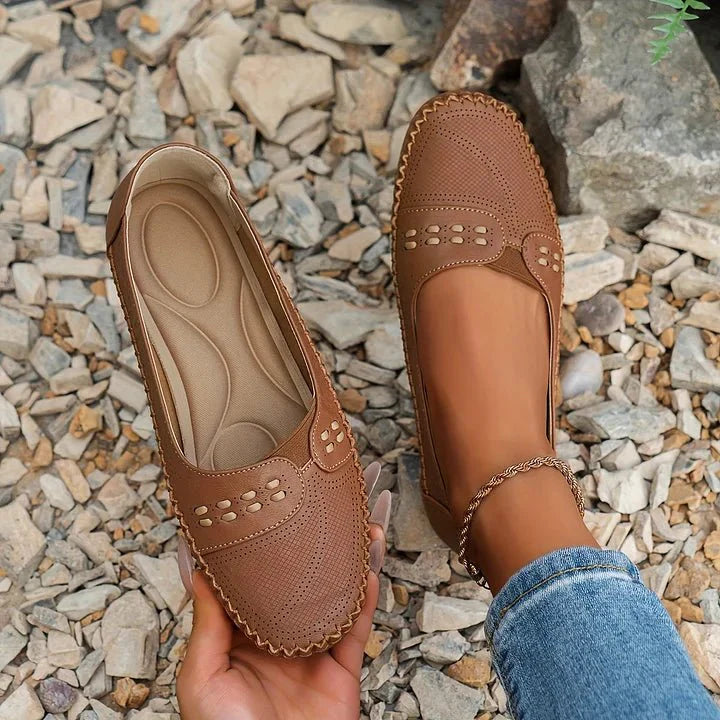 Breathable women's perforated loafers, orthopedic comfort for all-day casual footwear.