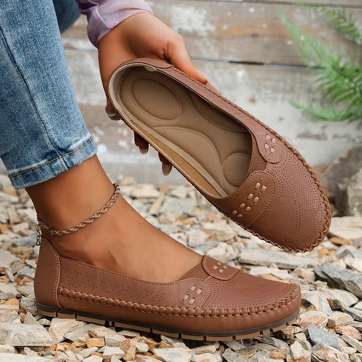 Supportive women's orthopedic flats; perforated slip-on loafers for ultimate comfort.