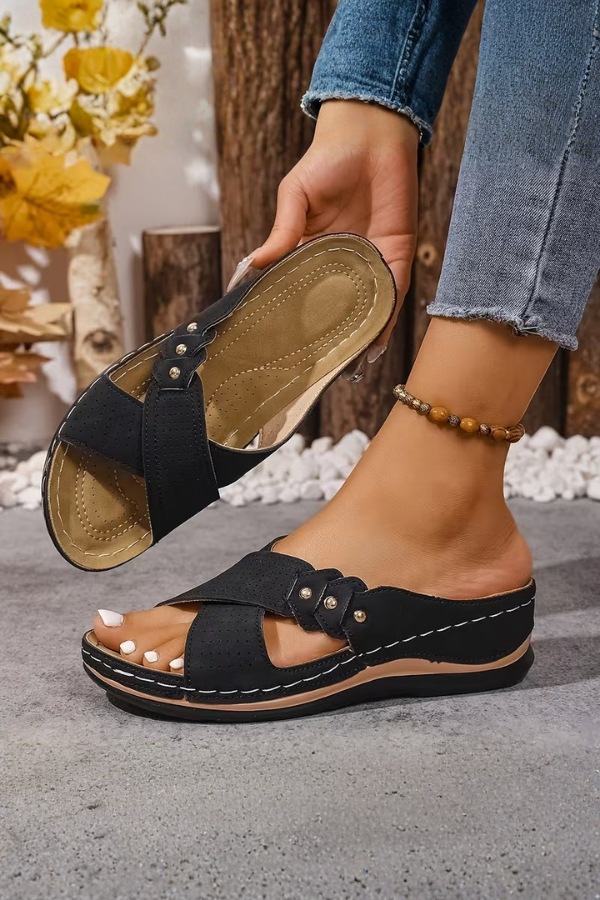 Lightweight women's slip-on wedge sandals, perfect for summer casual looks and travel comfort.