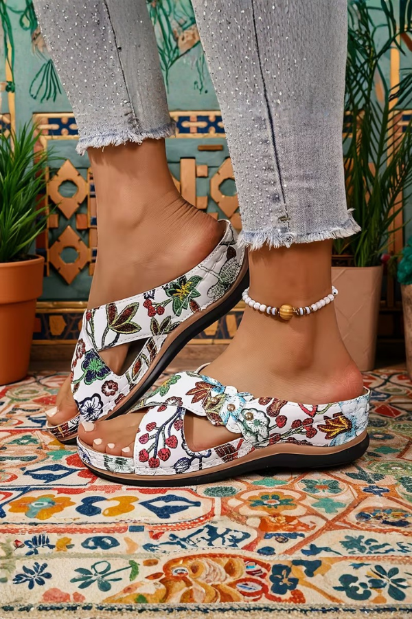 Stylish women's wedge comfort sandals with perforated design, ideal for summer daily wear.