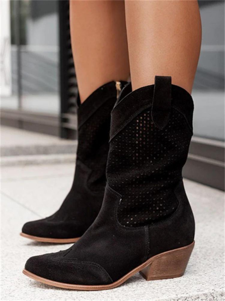Stylish women's perforated western boots, mid-calf height, featuring a pointed toe and comfortable low heel.