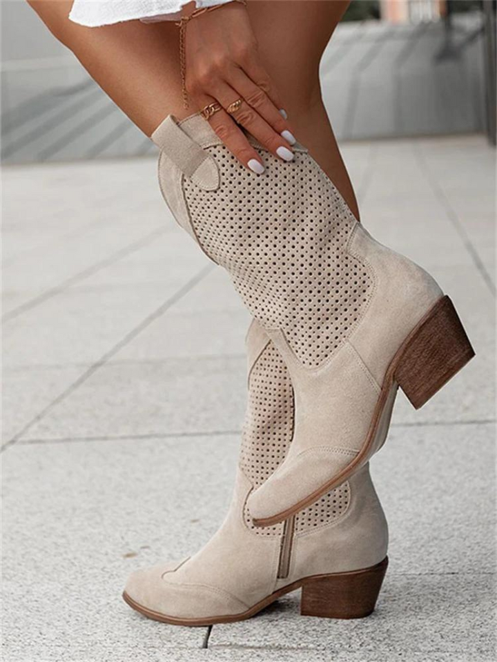 Fashionable women's mid-calf western boots, perforated design, perfect fall footwear for a casual cowgirl look.
