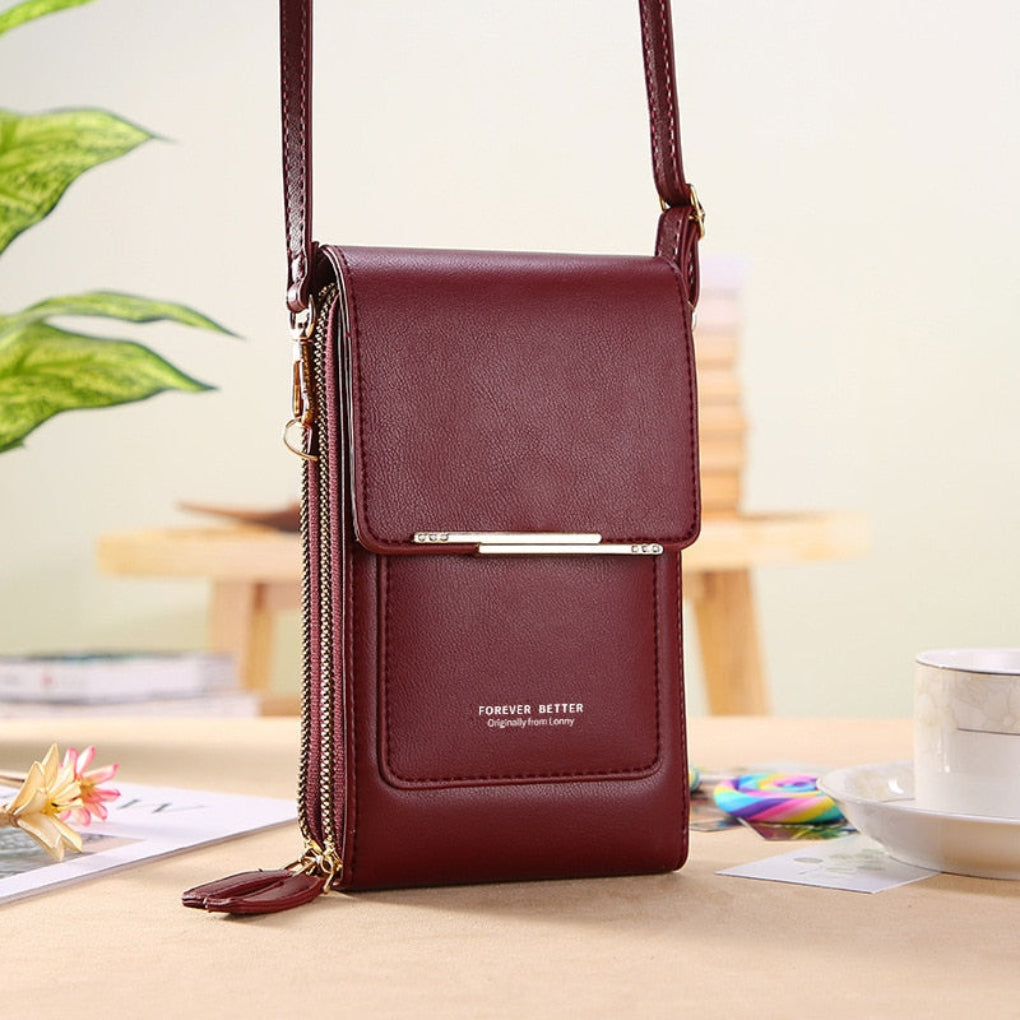 Elegant women's small crossbody bag with a dedicated touchscreen phone compartment, ideal for travel & daily use.