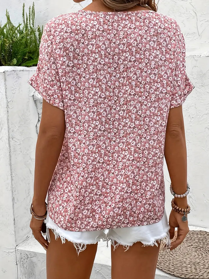 Elegant women's floral print button-up blouse with a relaxed fit. Versatile for casual chic or office fashion.