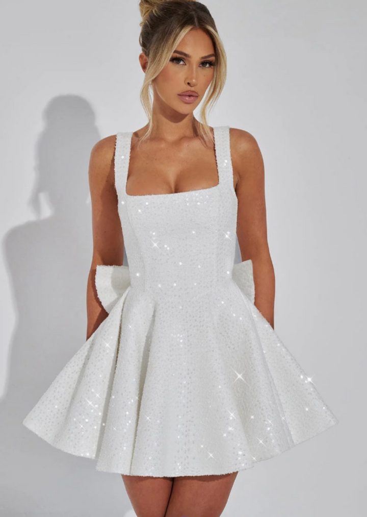 White sequin skater dress for women, featuring a cute bow, ideal for homecoming, formal or special occasions.