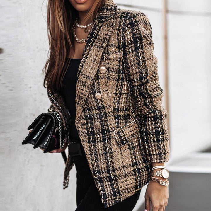 Chic women's plaid blazer, double-breasted with gold buttons. A versatile statement piece for elegant professional wear.