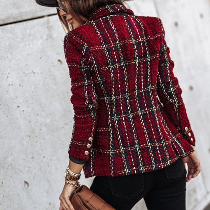 Stylish women's plaid tailored blazer, double-breasted with prominent gold buttons, offering a sophisticated fit.