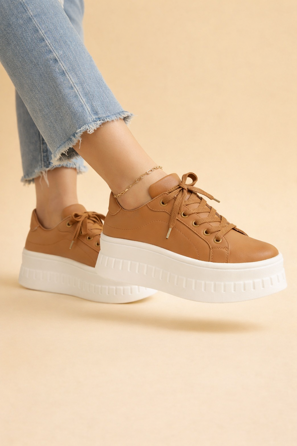 Women's platform sneakers with cushioned sole for all-day comfort. Stylish, trendy lace-up design for everyday wear.