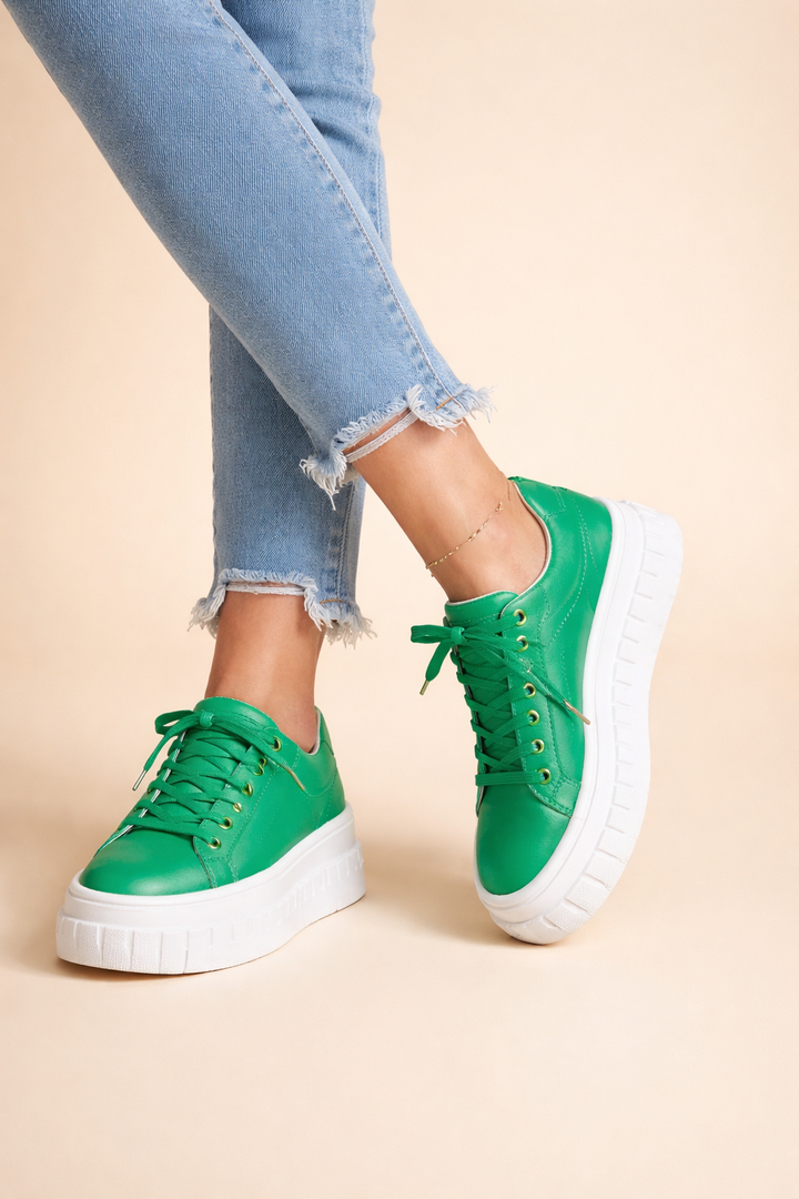 Fashion-forward women's platform sneakers. Cushioned sole ensures comfort for casual, everyday wear. Stylish and trendy.