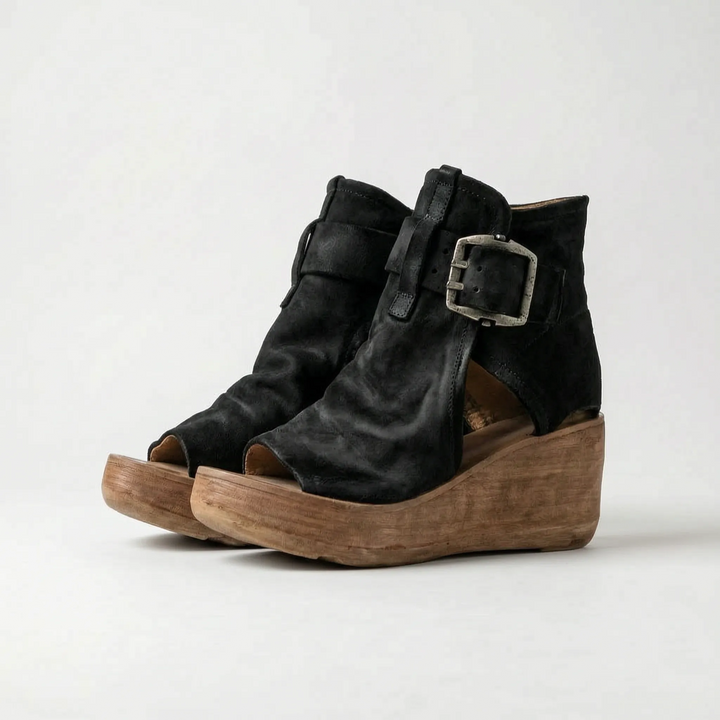 Stylish women's platform sandals with a wedge heel and an elegant ankle strap for casual fashion.