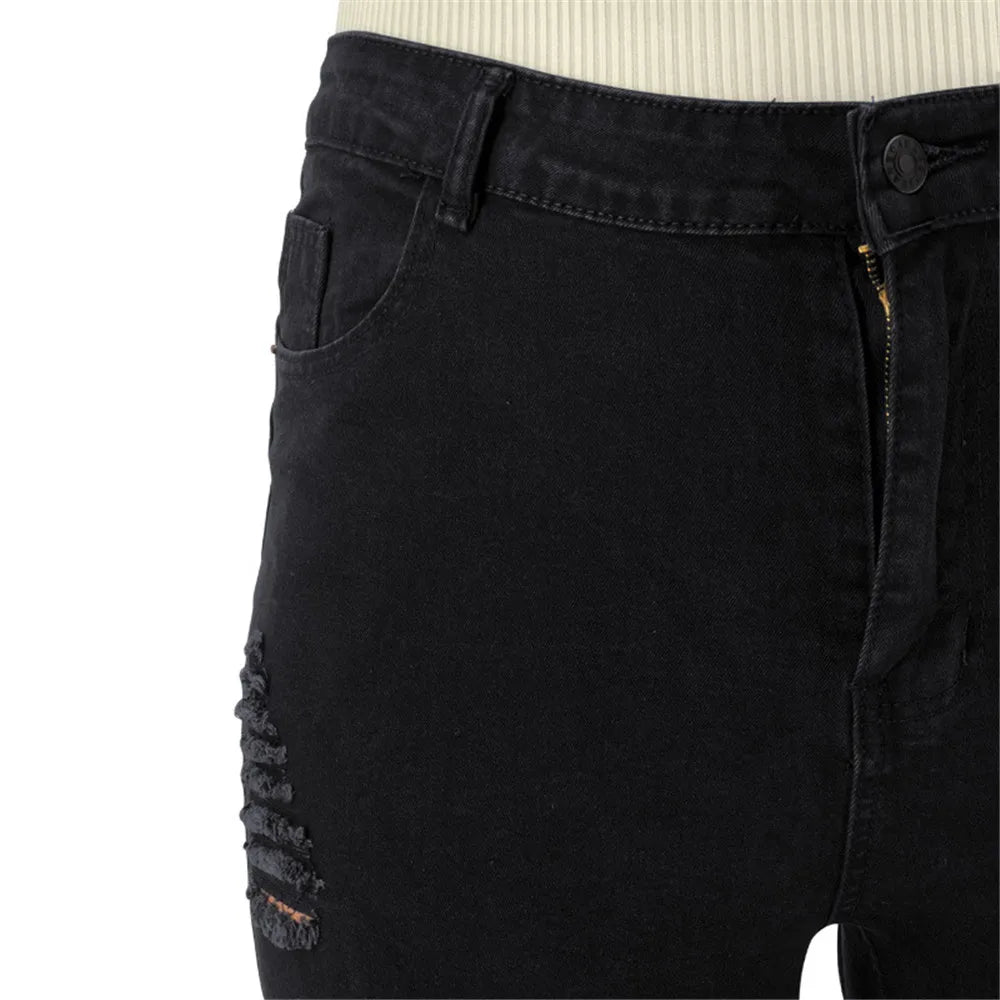 Ripped plus size flared jeans for women, high-waisted design with stretchy, durable denim.