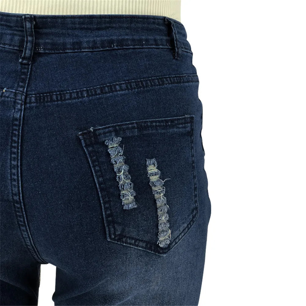 Trendy plus size denim, high-waisted ripped flared jeans designed for a perfect women's fit.