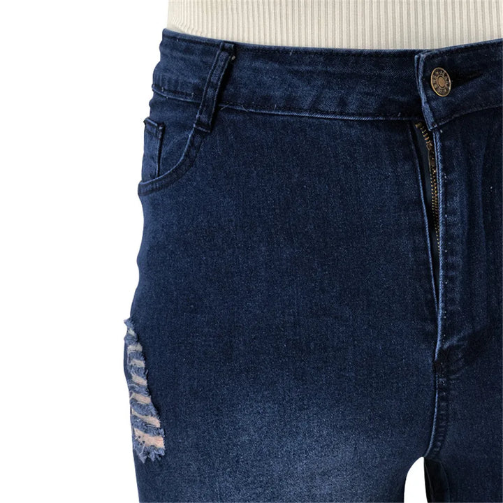 Women's plus size high-rise flared jeans with rips, trendy denim for a casual, comfortable look.