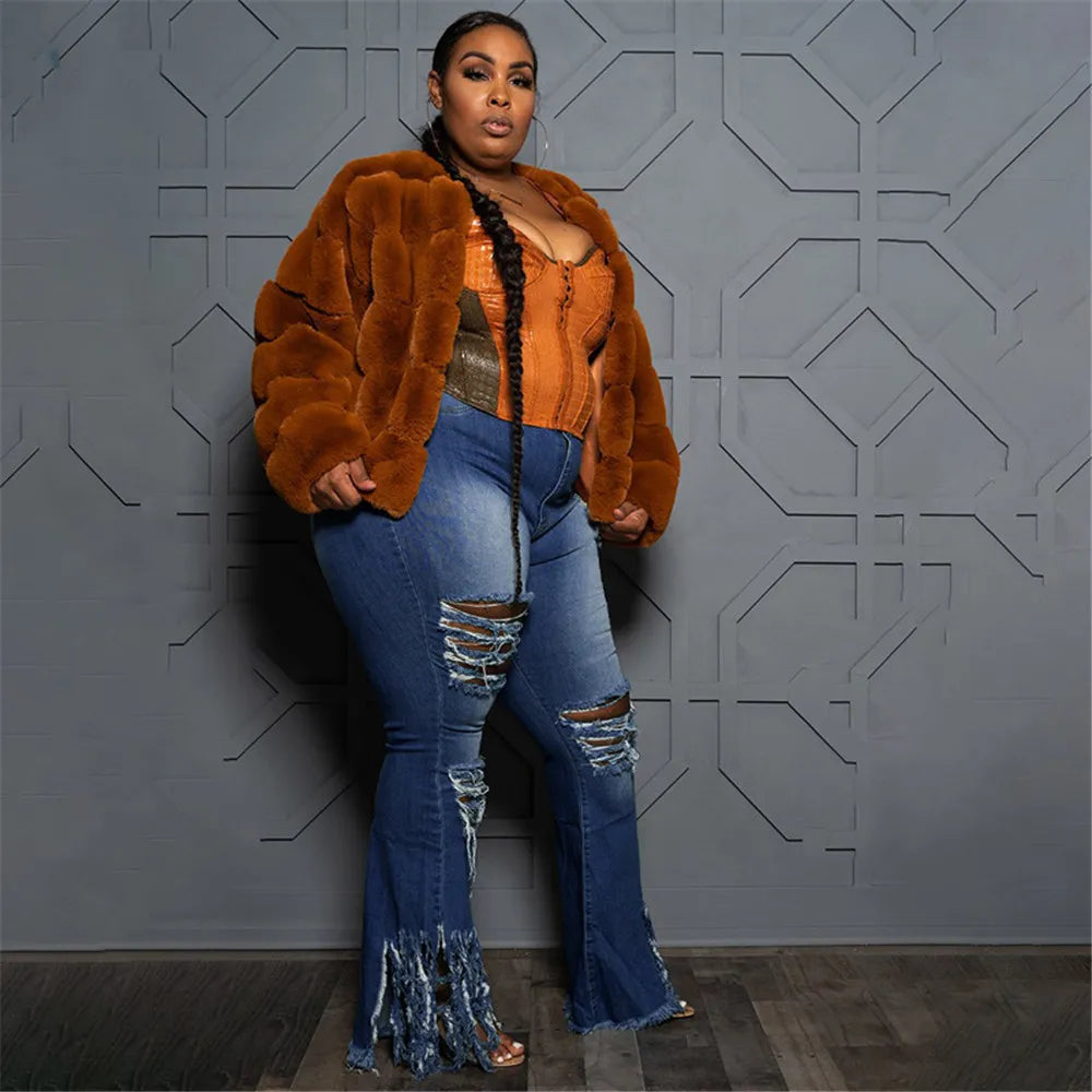 Plus size women's stretch denim flared jeans, high-waist ripped style for a modern silhouette.