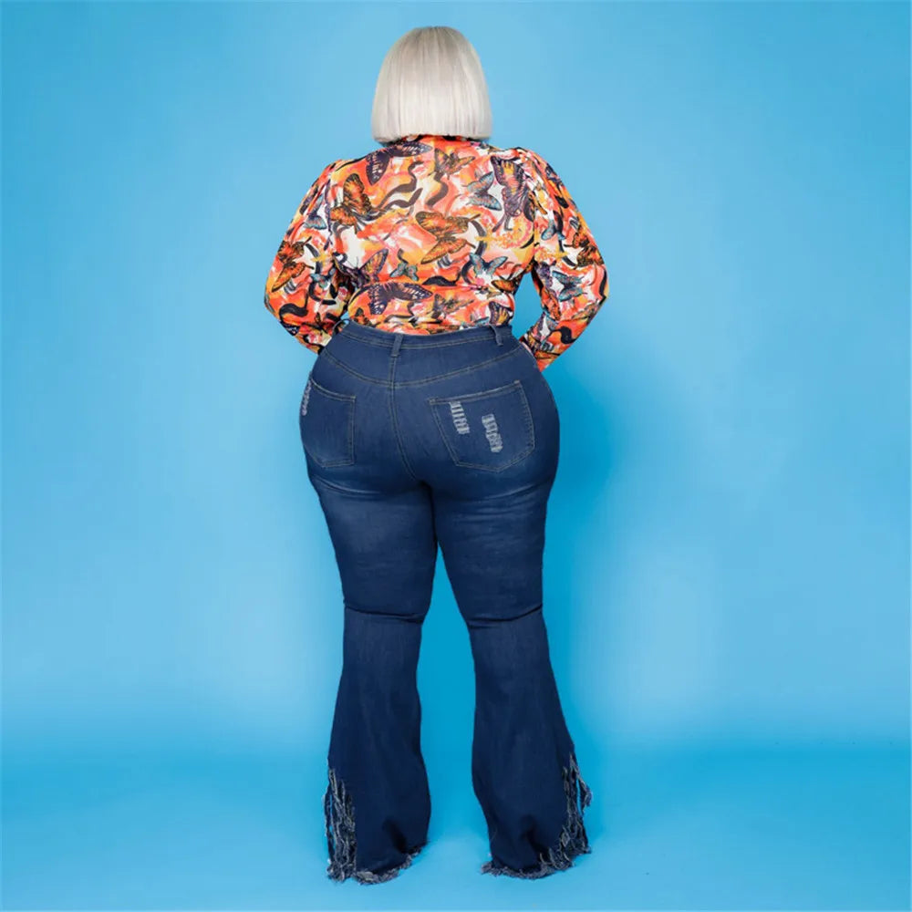 Stylish plus size high-waisted flared jeans for women, featuring trendy rips & comfortable stretch.