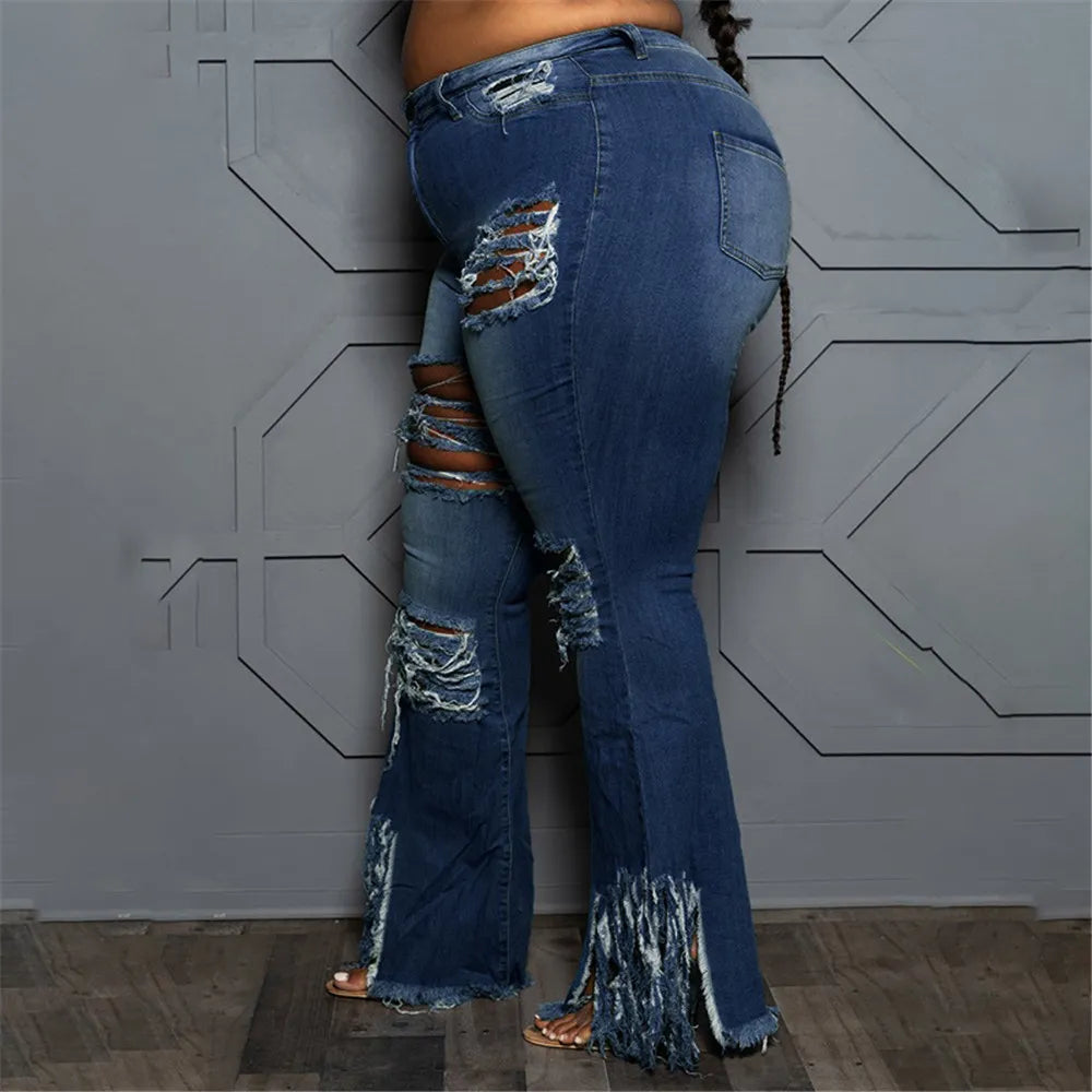 Women's plus size denim flared jeans, high-waist and ripped for a fashionable, flattering fit.