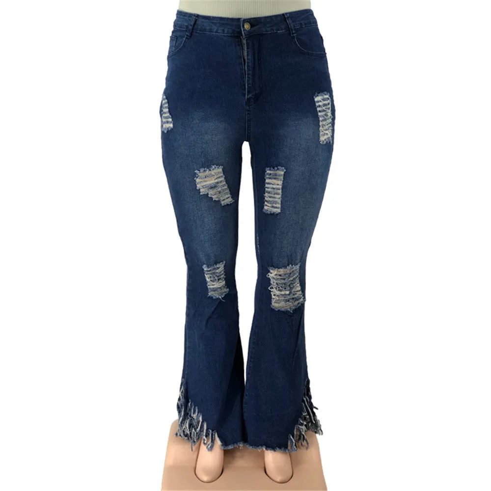 Trendy plus size ripped flared jeans for women, featuring a flattering high waist & stretch denim.