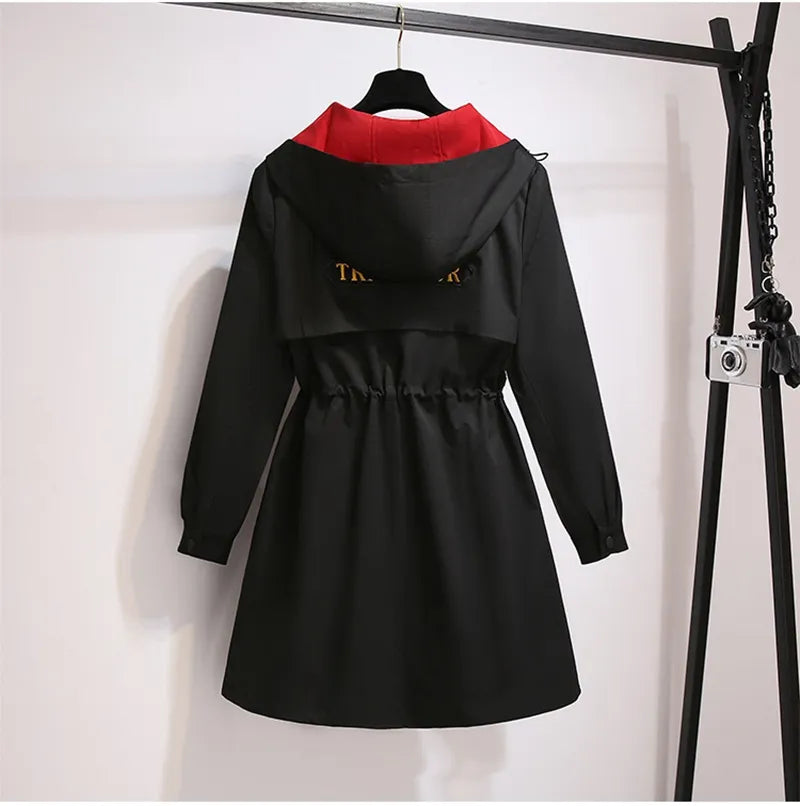 Oversized hooded windbreaker for plus size women, great for unpredictable transitional weather.