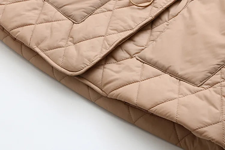 Flattering plus size padded jacket for women, autumn leaf print. Ideal fall fashion.