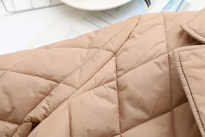 Stylish women's plus size padded jacket, elegant fall leaf design. Flattering fit.